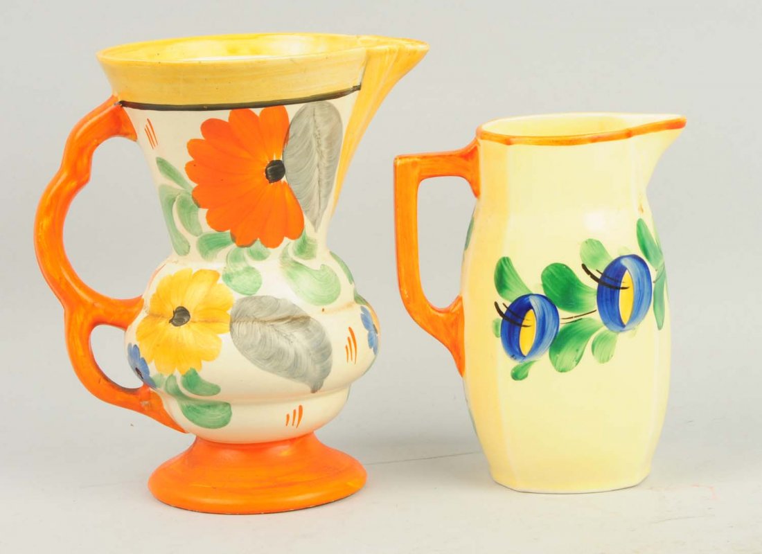 Lot of 2: Pottery Pitchers.: One pitcher in this lot was made in Czechoslovakia and the other in England. No chips or cracks. Condition (Excellent). Size Largest: 8 - 1/4" T