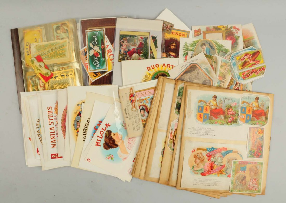Large Lot of Cigar Box Labels.: Includes a large scrapbook full of very interesting cigar box labels. Also includes several hundred loose labels as well. Condition (Very Good).
