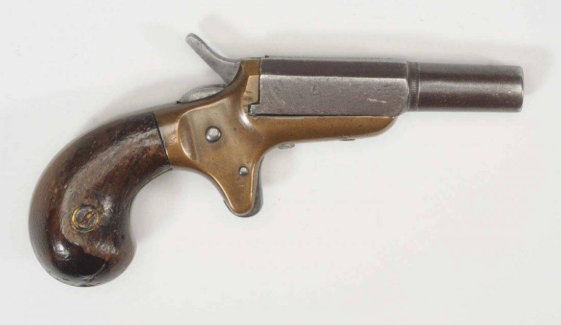 US .22 Cal. Pocket Pistol.: E. Allen manufactured vest pocket pistol in very good condition with brass frame, iron side tilt barrel with walnut grips. Very small diminutive size pistol. Overall length 4” and barrel length 2”