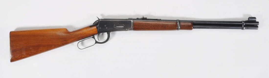 Winchester Model 1894 Carbine .30WCF Cal.Rifle.**: Serial No. 1574101. Barrel length 20" round. Lever action. Length of pull 13". Pre 64. Excellent slick action and bore. Gun has 80% thinning blue. Stock has a well repaired crack at top and was refini