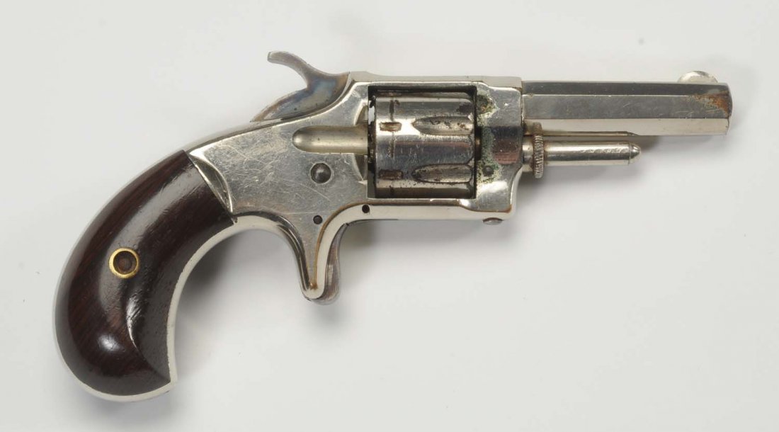 Whitneyville Armory Pock Revolver Spur Trigger.: Serial No. 10105D Whitneyville Armory small caliber metallic cartridge pocket pistol with nickel finish and rosewood grips in very good condition. Overall length 6” and barrel length 2 - ¼”. UPDA