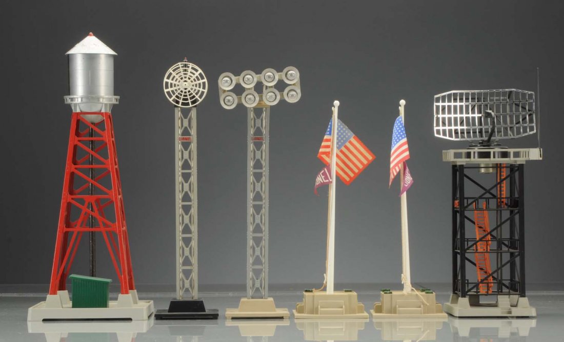 Assortment of Lionel Post War Accessories.: Lot includes No.197 radar tower, antenna, which looks to be a reproduction, all railing which is intact, two Lionel flag poles. The flags look to be replacements and one needs the green felt on the ba