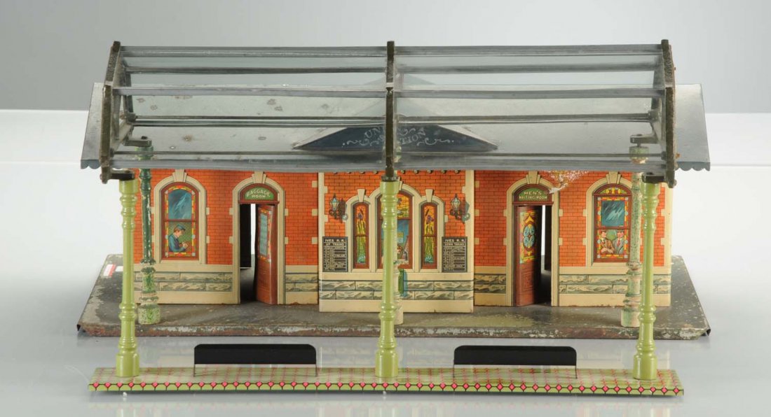 Ives Union Station with Glass Dome.: The station is complete, all original, and it has scratches and paint chips mainly on the base. Its lithography on the sides is very nice,and it comes with a complete glass dome. The dome is a reprodu