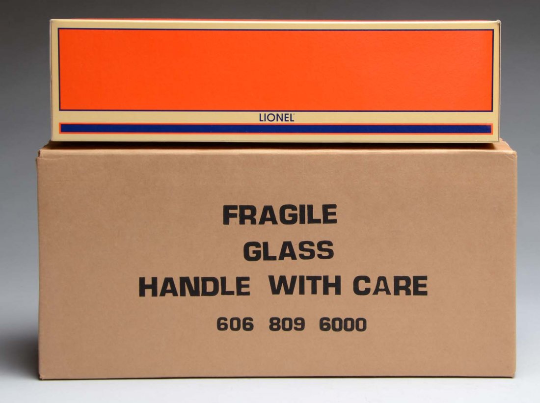 Lionel AT & SF GP-9 Diesel Engine.: Contemporary. Original individual box and shipping box. Also comes with an open glass case. This was a JC Penny Special. Also comes with a name plate marked "1997". Unused. Condition (Near Mint). Size