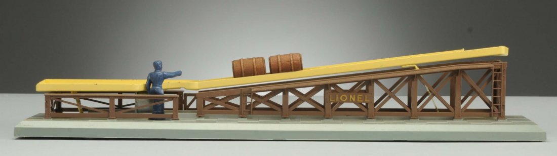 Lionel 362 Barrel Loader.: It is in the original box. Barrel loader itself is very clean, attractive, and comes with No.364C control button. Six original barrels are in the original box, but the box has a torn lid, parts envelo