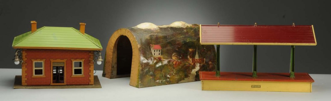 Lot of 3: Lionel Tunnel & Stations.: It includes No. 155 freight station which has early colors, is complete, all original, and has some scratches and paint chips throughout. It is in a very good condition; No. 124 station with outside l