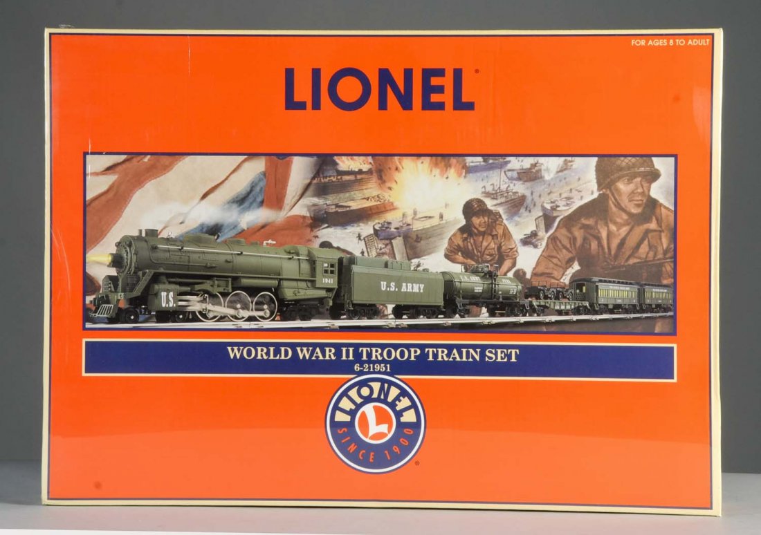 Lionel 21951 WWII Troop Train Set.: It includes 4-6-2 steam locomotive and matching tender, one tank car, one flat car with two jeeps, and two passenger cars. All are sealed in the original box. Condition (Mint).