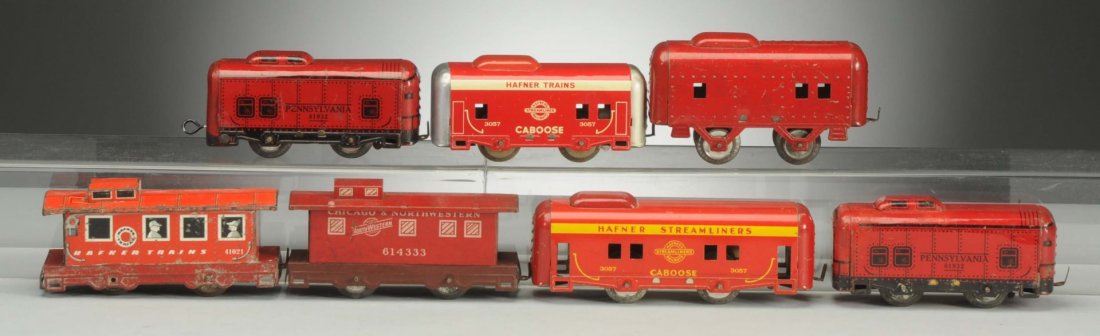 Lot of 7: Assorted Hafner Cabooses.: The No.357 streamline caboose is complete and all original. One all red no number caboose has scratches, otherwise it is complete and all original. Two No.81932 PRR cabooses are complete and all origi