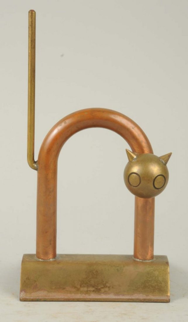Deco Cat Doorstop.: Whimsical cat in polished copper and brass was designed by famed industrial designer Walter Von Nessen for The Chase Brass and Copper Company during the 1930’s. Condition (Excellent). Size 8 - 3/4" 