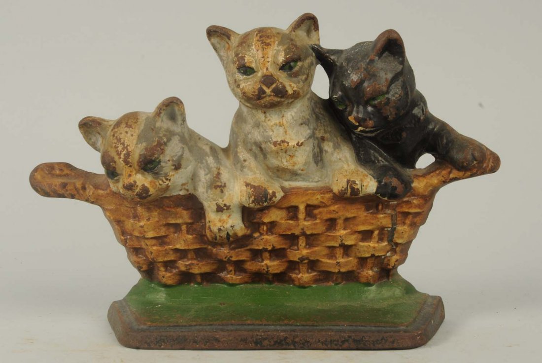 Cast Iron Three Kittens in Basket Doorstop.: Wilton Products. “Copyright 1932, M. Rosenstein, Lancaster, PA., USA”. Delightful depiction of three kittens in wicker basket. Condition (Very Good). Size 6 - 3/4" T.