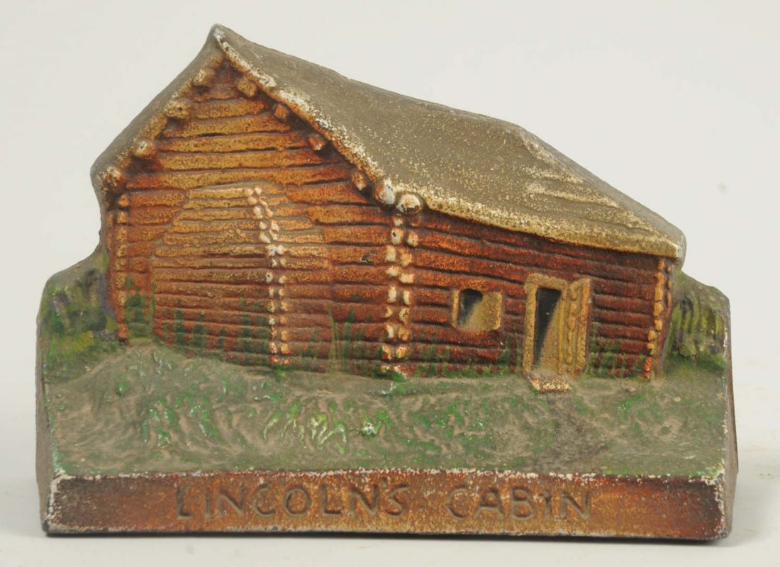 Cast Iron Lincoln Log's Cabin Doorstop.: Signed on front of base, “Lincoln’s Cabin”. Condition (Excellent). Size 4 - 1/4" T.