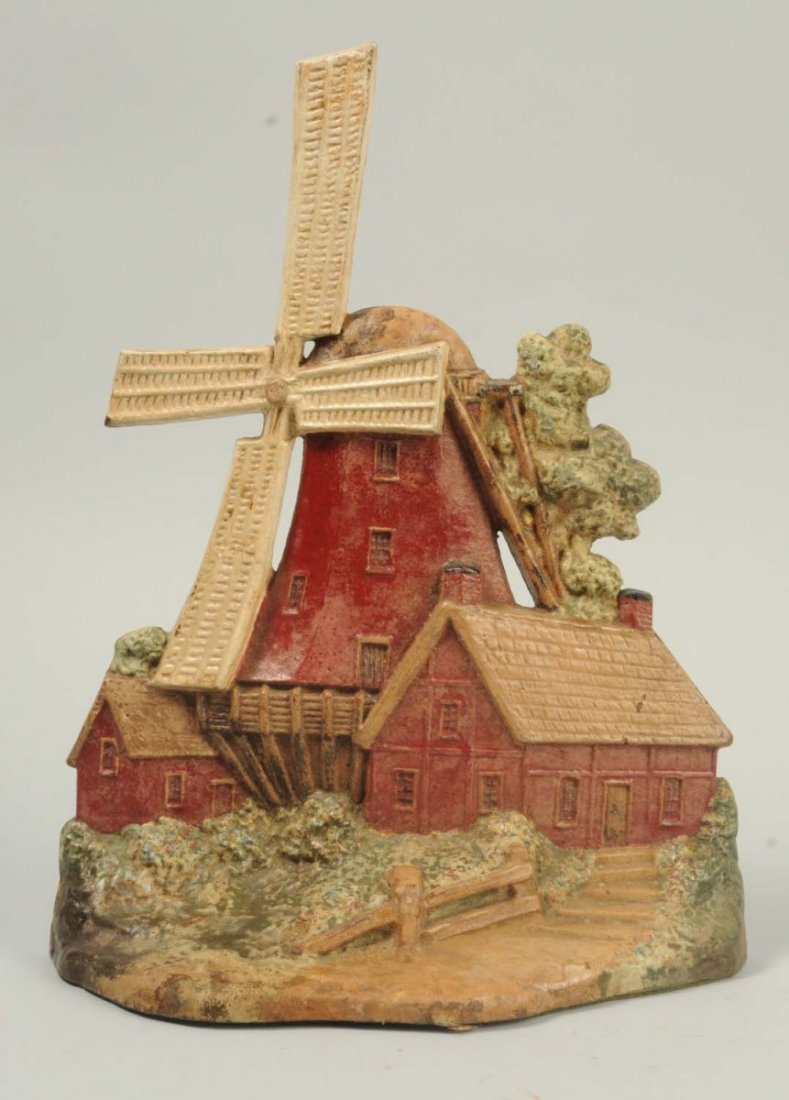 Cast Iron Windmill with 2 Cottages Doorstop.: Signed, dated, and numbered, “Copyright 1926, by A.M. Greenblatt Studios, Boston, 6”. Condition (Excellent). Size 11 - 7/8" T.