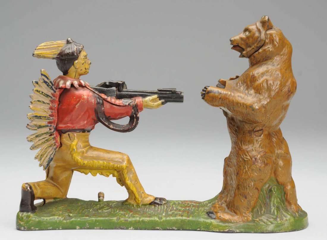 J&E Stevens Indian & Bear Mechanical Bank.: Brown bear. Original feathers and trap. Condition (Excellent - Excellent Plus). Size 10" L.