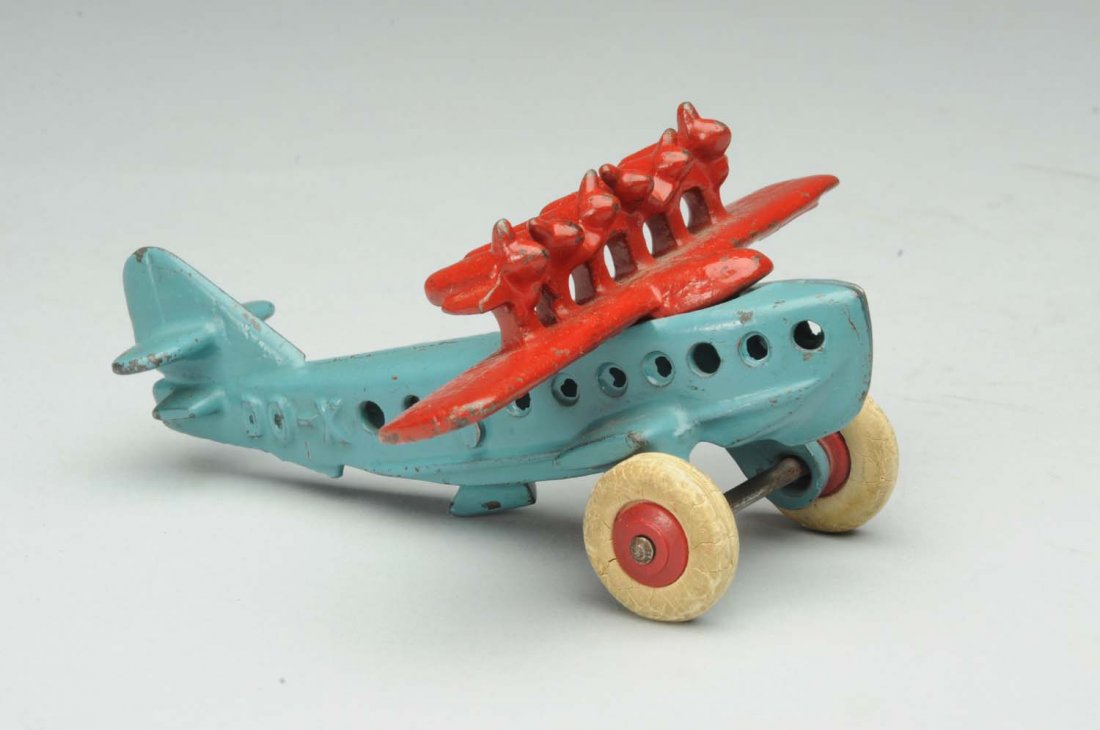 Cast Iron Hubley DO-X Airplane.: Smaller version. Plane has white rubber tires on red wooden hubs. Embossed DO-X on both sides of fuselage. Minor to moderate paint chipping and wear. Condition (Very Good - Excellent). Size 5" L.