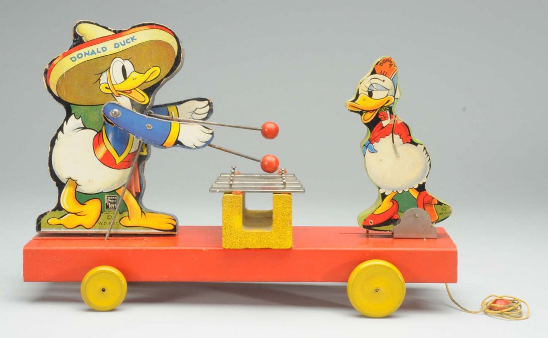 Fisher Price Donald & Donna Duck Toy.: Circa 1937. Paper on wood. Marked '#160'. All original. Donna Duck is missing cardboard arms. Some paper loss on top of Donald Duck's hat. General over-all wear.. Marked 'W.D. Ent.' Condition (Very Go