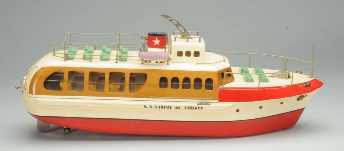 Statue Of Liberty Wooden Boat.: Japanese. Battery-operated. Marked 'S.S. Statue Of Liberty' on both sides of hull. Original seats and lifeboats. Very little wear. Condition (Excellent - Near Mint). Size 18 -1/2" L.