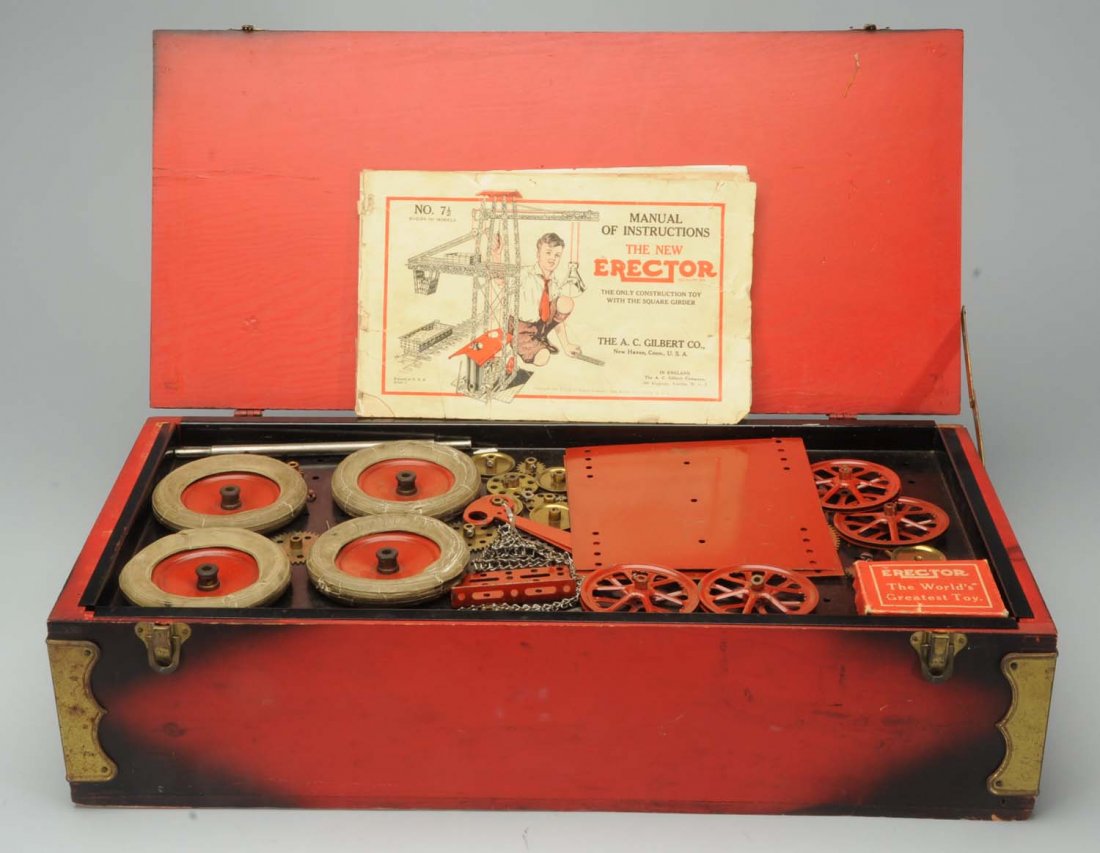 A.C. Gilbert Erector Set: Complete with original wooden box. Includes manual. Manual is marked No. 7 1/2 and has some creasing and tearing. Has original shelf and four white rubber tires. Mostly complete. Box has some wear on 
