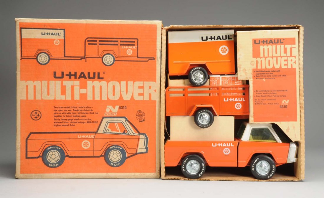 U - Haul Multi- Mover w/ Box.: Ny-Lint U-Haul Multi-Mover No.4310. Pressed steel truck with two U-Haul trailers. Three piece set is all complete and original. Unplayed-with condition with original box. Box has nice colors and graph