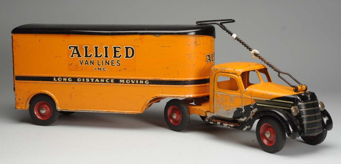 Pressed Steel Buddy L Allied Van Lines Truck.: Original condition. Significant paint loss and flaking throughout. Original pull handle and box. Condition (Good - Very Good). Size 30" L.