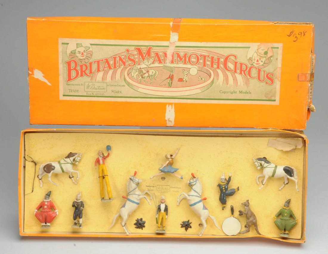 Britain's Diecast Metal Mammoth Circus Figure Set: Includes original box. Marked "London, England". Also marked "Circus No. 2054". One small piece missing off side apron of lid. There is split in the corner of the box and some tape residue and paper l