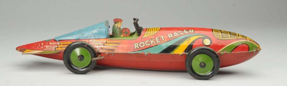 Marx Tin Wind-Up Rocket Racer.: All original. Significant corrosion and paint loss throughout. Condition (Good). Size 17" L.