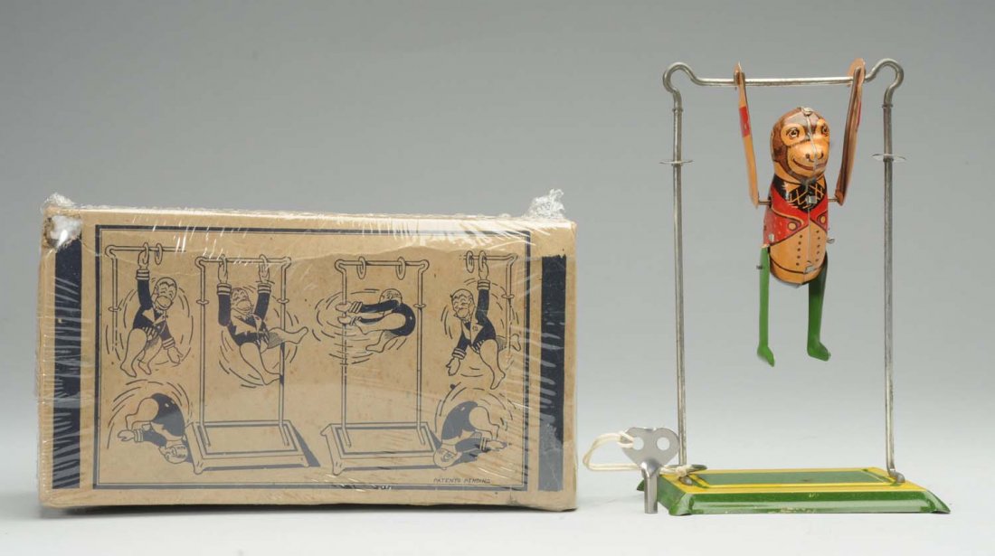 Tin Litho Marx Tumbling Monkey & Trapeze Toy.: Wind-up. Includes box. Box has light creasing and is in protective plastic. When in operation, toy performs on trapeze. Very little wear. Condition (Excellent). Size 8" T.