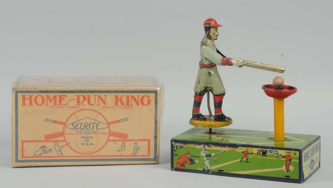 Selrite Home Run King W/ Box: Wind-Up. All original. Significant paint loss and edge wear to figure. Includes wooden balls. Original box has creasing and wear throughout. Condition (Very Good). Size Largest: 7" L