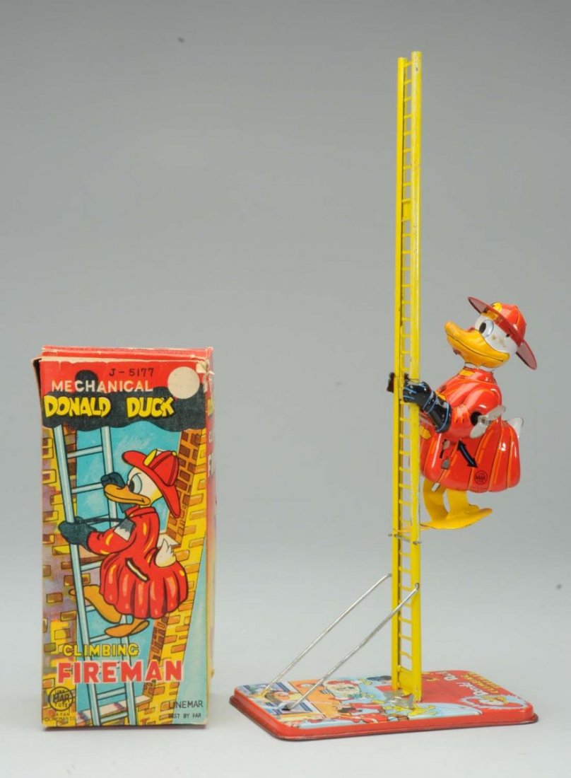 Tin Litho Linemar Wind-Up Donald Duck Fireman.: Walt Disney Donald Duck climbing fireman toy. Comes with colorful original box. Box has some slight tearing and creasing at top. Original ladder. When in operation Donald Duck climbs up the ladder . C