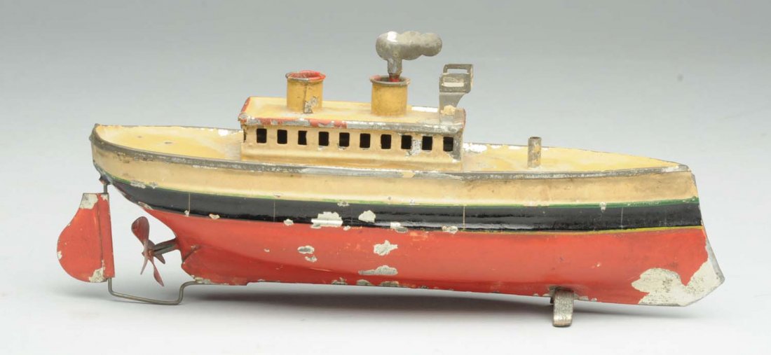 Tin Carette Wind-Up Painted Ocean Liner: German. Some paint loss and shipping throughout. Wind-up mechanism is not working. Condition (Very Good). Size 8 - 1/2" L.