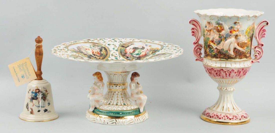 Lot of 3: Porcelain Pieces.: This lot includes a Capodimonte Compote, and Capodimonte vase, and a Normal Rockwell commemorative bell. Condition (Excellent). Size Largest: 11 -1/2" L.
