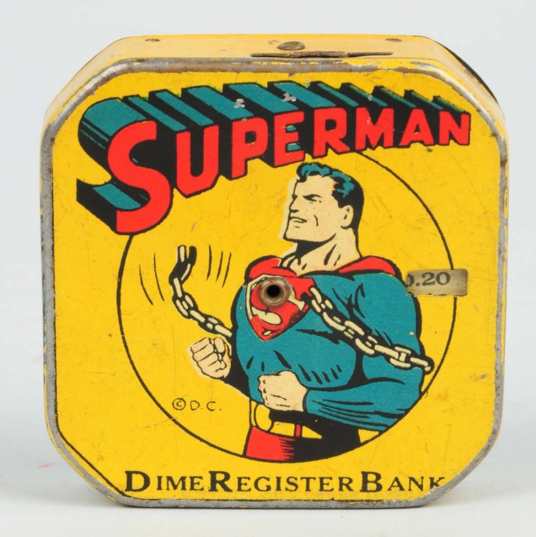 Circa 1940 Superman Tin Registering Bank.: This great little bank depicts Superman breaking his chains. There are very minor scratches here and there, and more substantial wear along the edges. Very nice eye appeal. The bank is embossed "Super