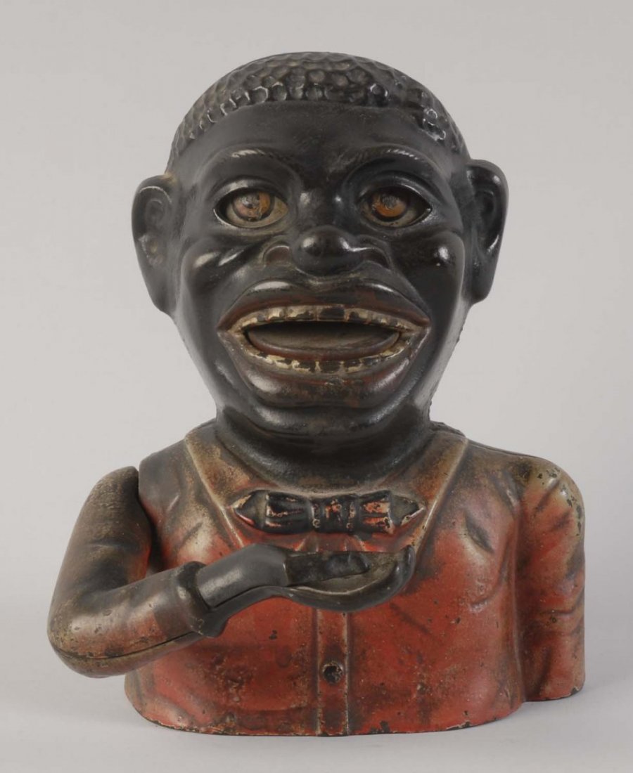 Jolly N. Mechanical Bank.: Manufactured by J&E Stevens Company and is in working condition. Jolly has red colored jacket, and his face is ver expressive. It is a well preserved toy. Condition (Very Good). Size 7" L.