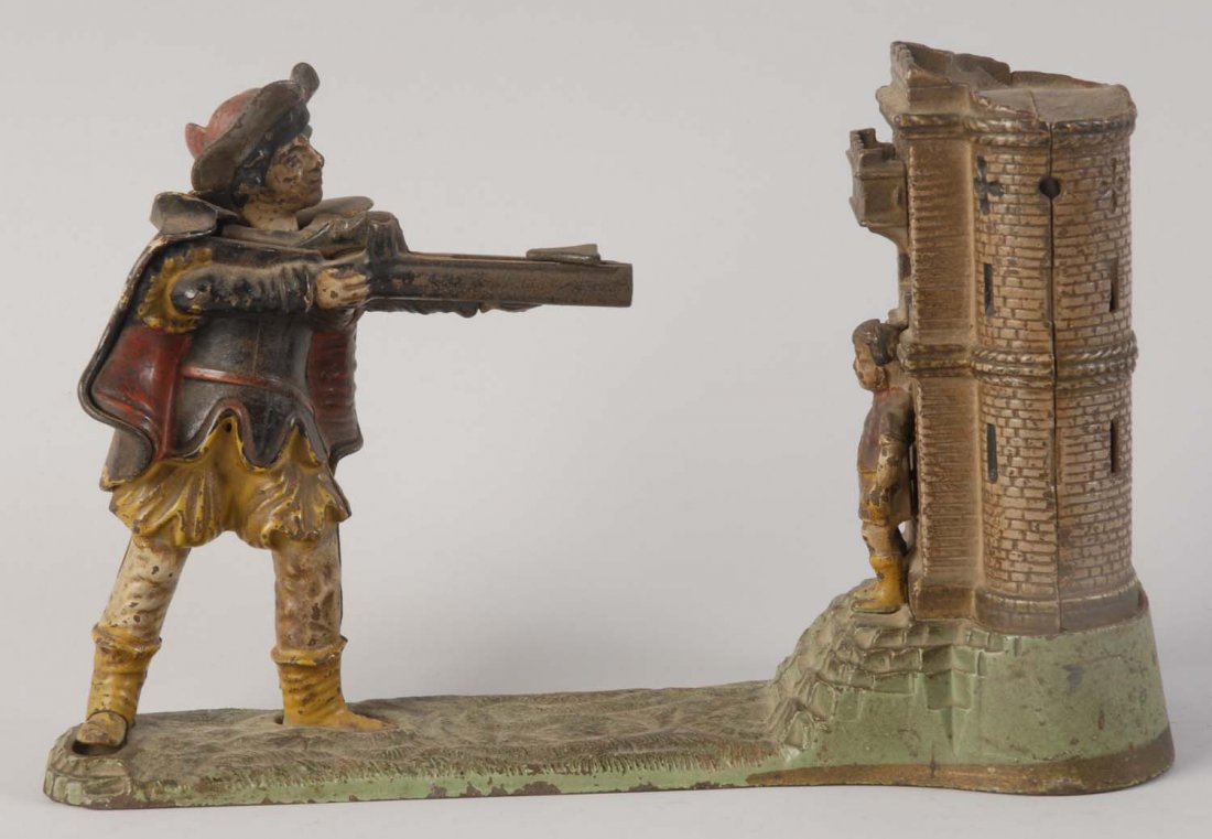 William Tell Mechanical Bank.: Manufactured by J&E Stevens Company. The boy figure has a crack in the head and a broken arm. The bank depicts a standing man with a gun pointed at a boy standing in front of a castle. There is some p
