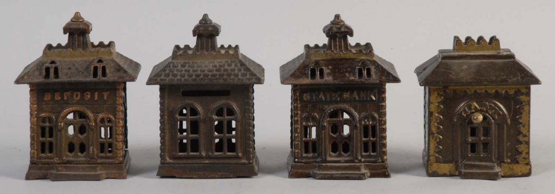 Lot of 4: Cast Iron Building Still Banks.: All banks have some paint scratches and are painted brown in color. They are excellently preserved. Condition (Excellent). Size Largest : 4 - 1/2" T.