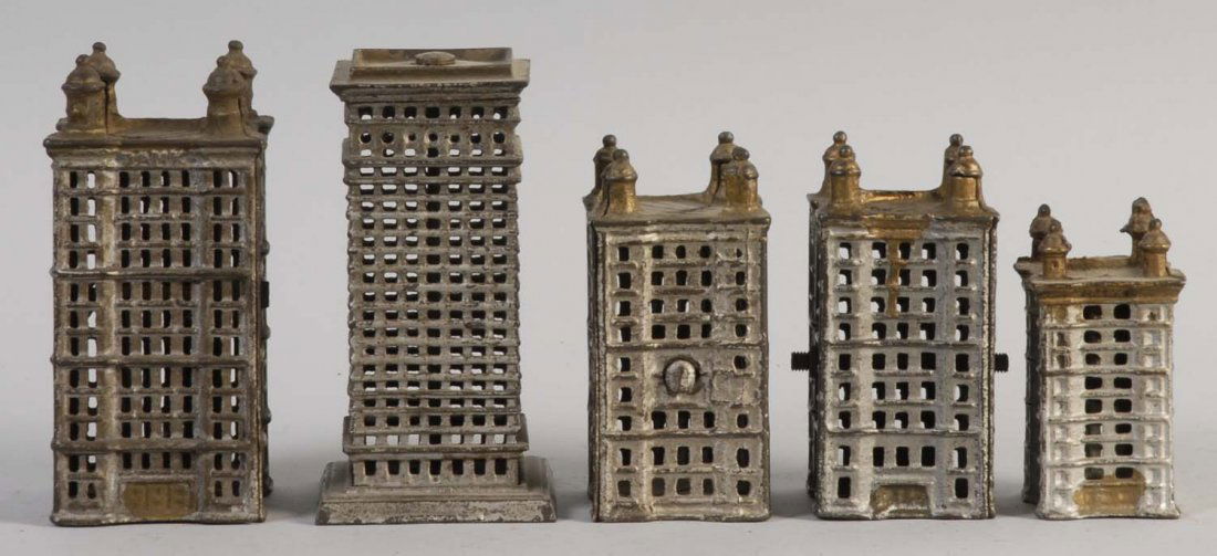 Lot of 5: Cast Iron Skyscraper Banks.: All banks have some minor paint discoloration. They are all painted in a silver color and are preserved excellently. Condition (Very Good - Excellent). Size Largset: 5" T.