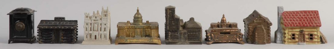 Lot of 8: Various Building Banks.: Made of cast iron and pot metal. All banks have minor paint scratches throughout. They are painted in nice brown, white, bronze, red, and yellow colors. The banks are preserved excellently. Condition 