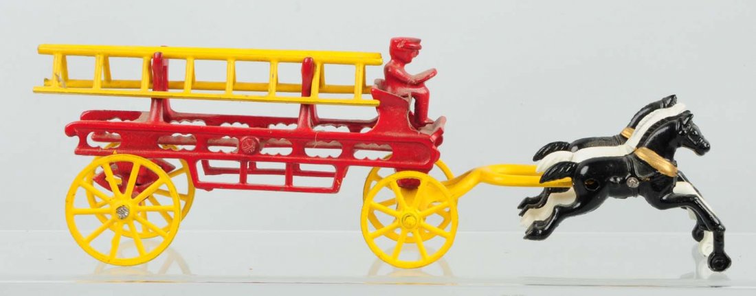 Lot of Fire Truck Wagons.: Includes three fire truck wagons, and two other wagons. All have some chips and paint loss throughout. Most include their drivers, and two wagons have their ladders. Overall, these are well preserved 