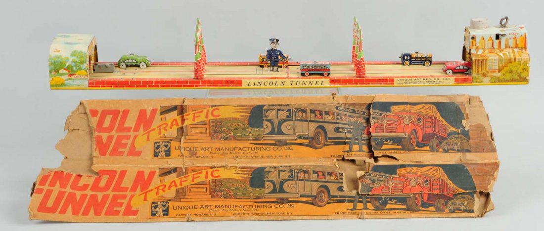 Tin Unique Art Lincoln Tunnel with Box.: The toy includes its original box. It has colorful graphics of various buses and trucks. It is marked "Lincoln Tunnel". The toy has minor scratches throughout. Otherwise, it includes the tin vehicles,