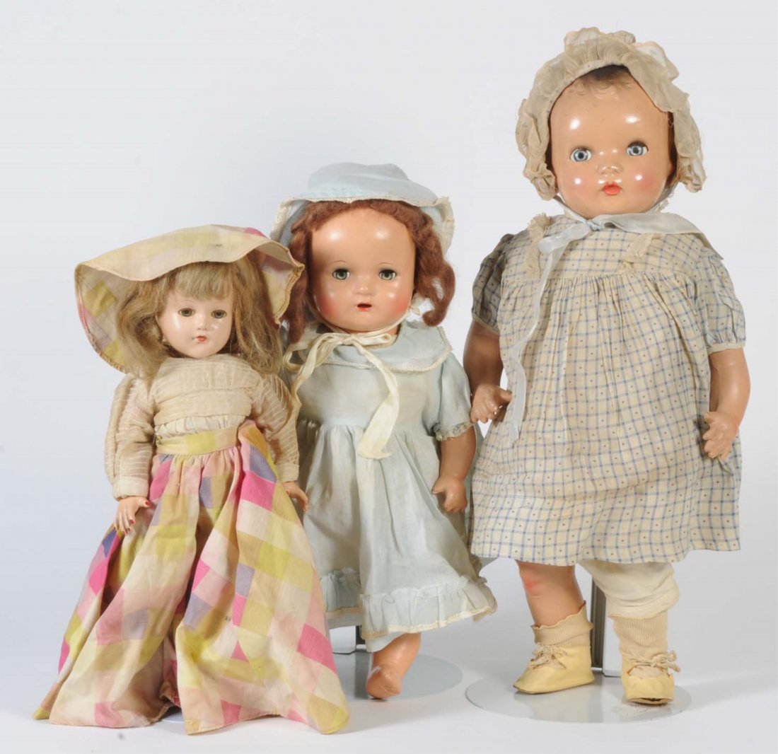 Lot of 3: Composition Dolls.: Two are unmarked dolls in vintage clothing and one is an Effanbee Ann Shirley with clothes as is. All dols have light crazing. Condition (Fair). Size Largest: 19" T.