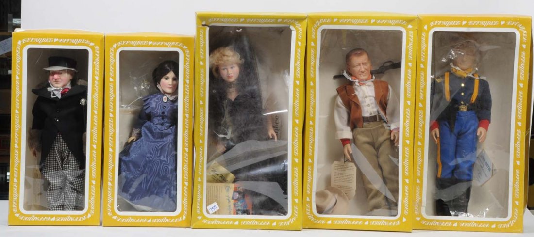 Lot of 5: Vinyl Effanbee "Legend Series" Dolls.: Includes two John Waynes, one Mae West, one Susan B. Anthony, and one W.C. Fields. All original in boxes which have some wear. Condition (Very Good). Size Largest: 17" T.