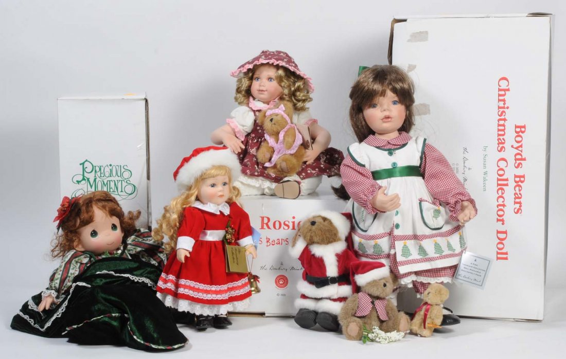Lot of 4: Vinyl Artist Dolls.: Consists of a mint in box Precious Moments doll, a mint in box Rosie Boyds bear, a mint in box Boyd Bear Christmas doll, and another Christmas doll. Condition (Excellent). Size Largest: 20" T.