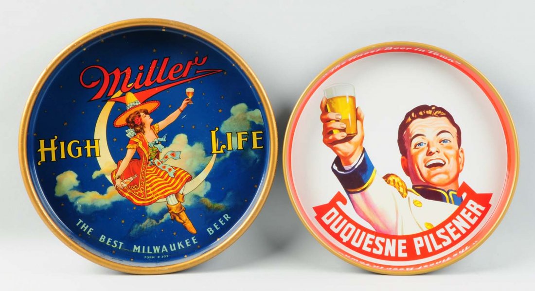 Lot of 2: Brewery Serving Trays.: Includes a Miller High Life tray with minor scratching to the rim. Also includes a Duquesne Pilsener tray in great condition. Condition (Very Good - Excellent). Size Each: 12" L.