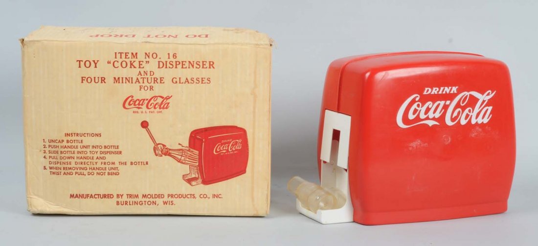 Coca-Cola Toy Dispenser.: This 1950s era Coca-Cola toy dispenser includes its original box. The dispenser has some minor wear but the box is clean. Condition (Very Good). Size 9" T.