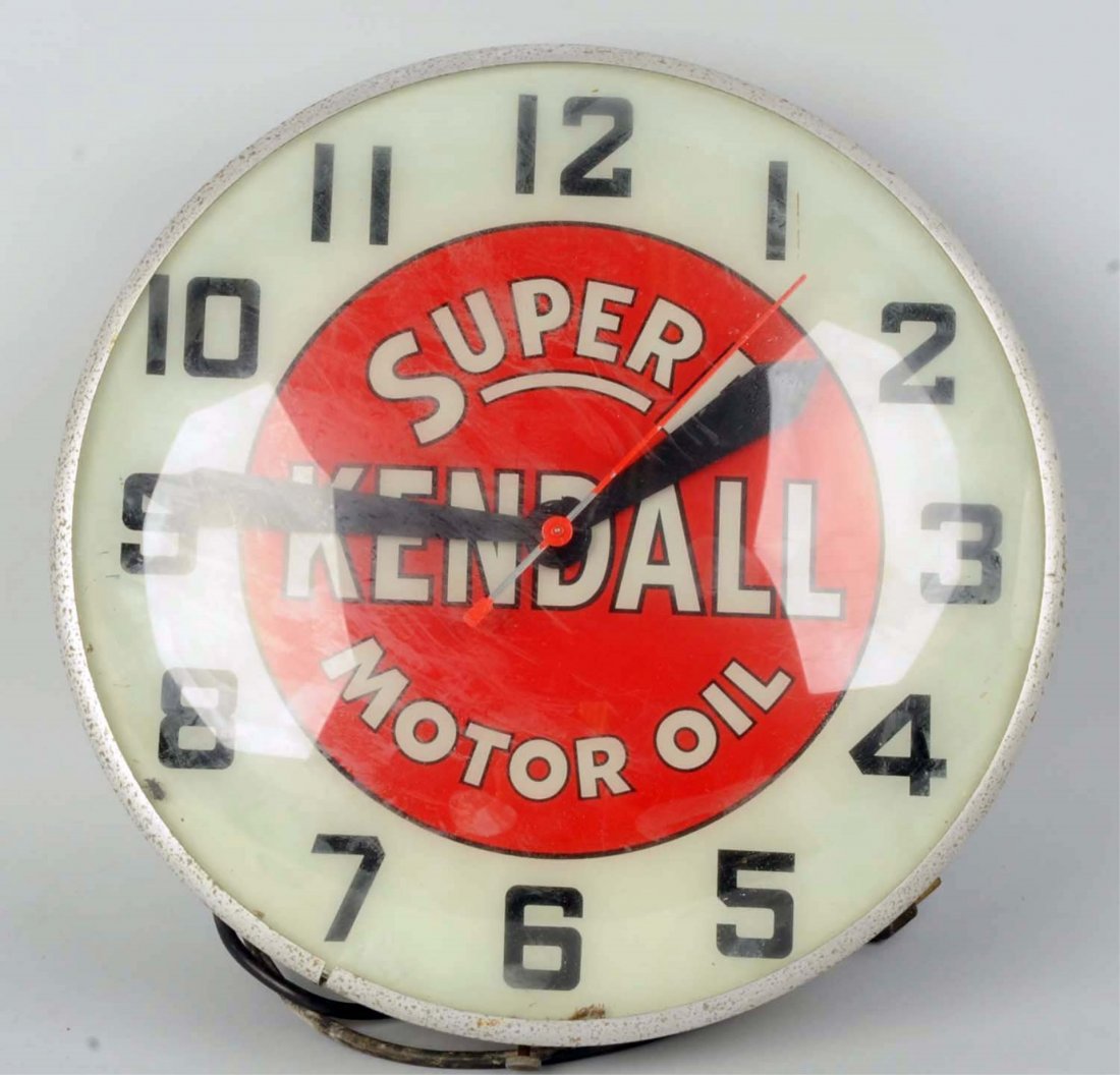 Kendall Oil Clock.: 1950s electric light up clock with light soiling and case wear. Condition (Very Good). Size 15- 1/2" L.