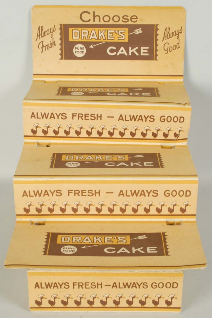 1940s-50s Drake's Cakes Cardboard Rack.: Some bends, small tears, and light soiling. Condition (Very Good). Size 15 - 3/4" x 18" x 12 - 1/2".