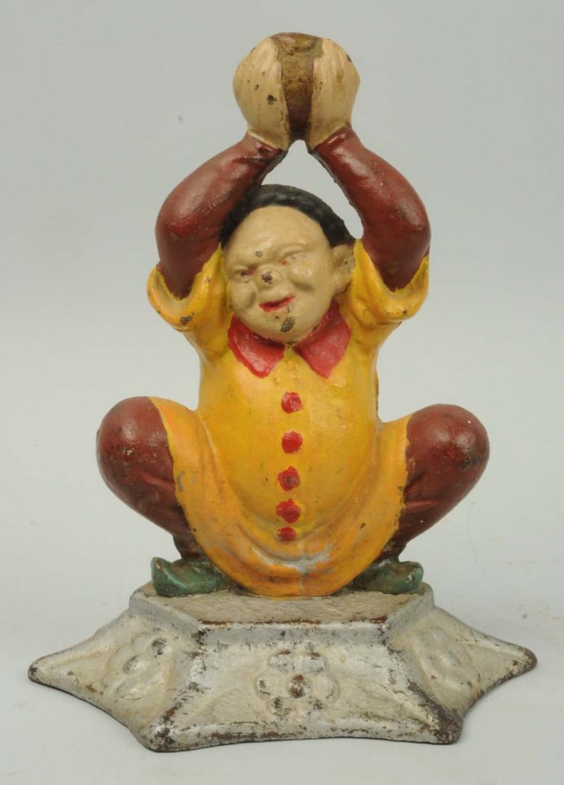 Cast Iron Chinese Jester Doorstop.: Ball broken off at top of hands. Condition (Good). Size 9 - 1/4" T.