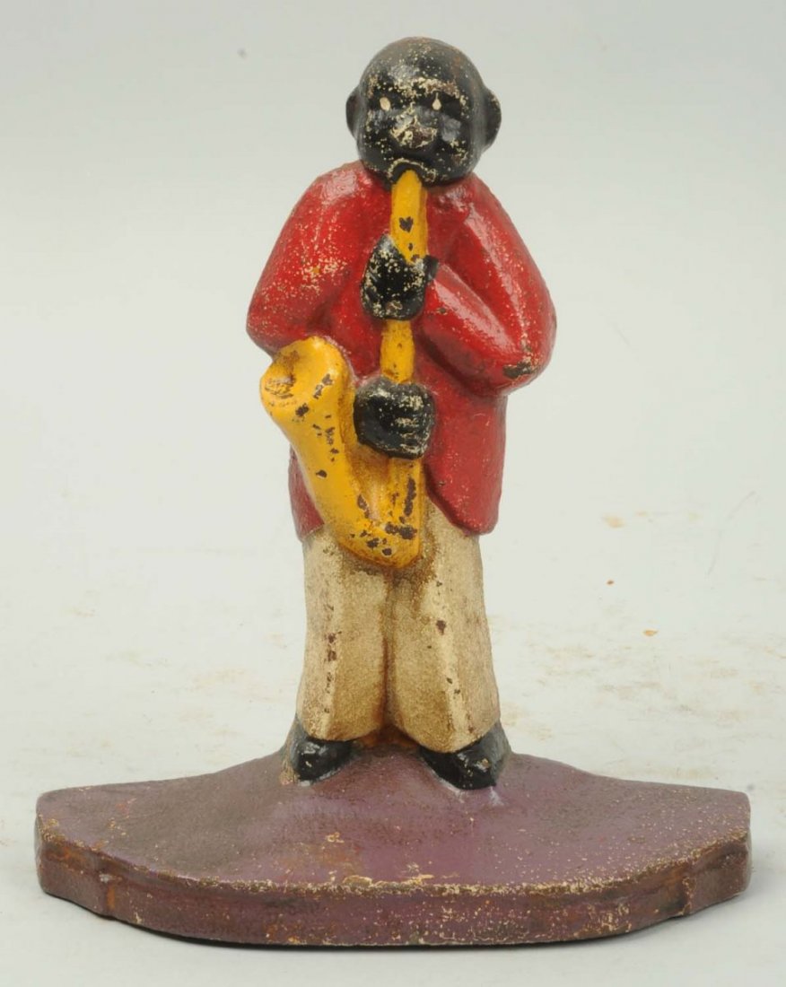Cast Iron Sax Player Doorstop.: Reproduction. Condition (Very Good). Size 7 - 1/8" T.