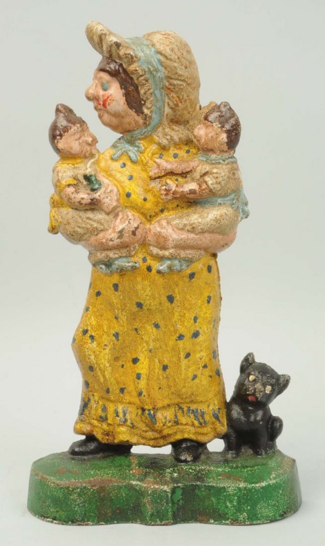 Cast Iron Miss Sloper Doorstop.: Reproduction. Condition (Excellent). Size 11" T.