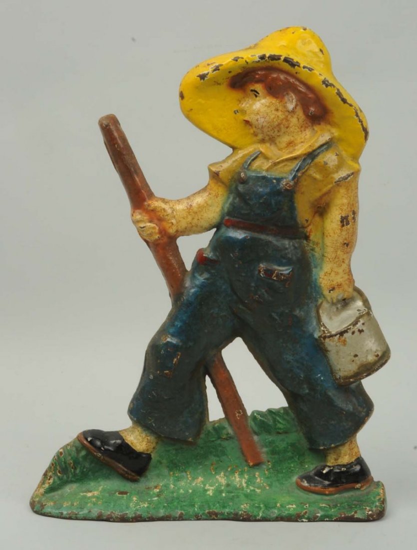 Cast Iron Huck Finn Wedge Doorstop.: Reproduction. Condition (Very Good). Size 12 - 5/8" T.