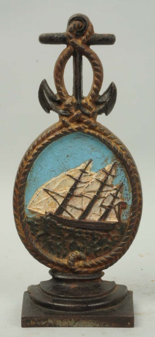 Cast Iron Ship Medallion Doorstop.: By Bradley and Hubbard. Medallion outline in rope intertwine in anchor at top. Repainted. Condition (Good). Size 11 - 1/4" T.
